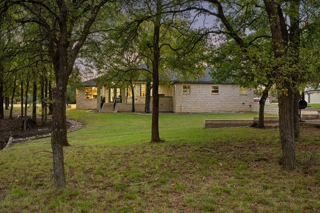 a view of a tree in front of a house