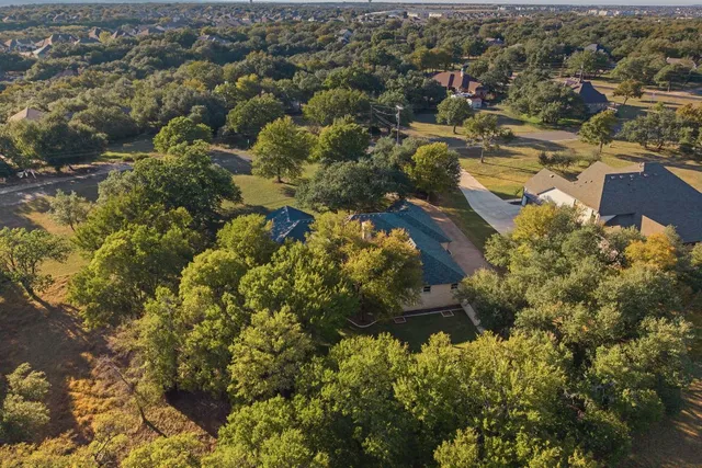 an aerial view of residential houses with outdoor space