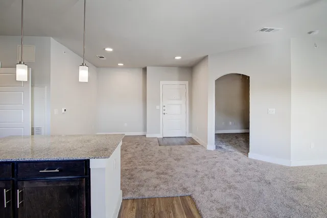 a view of a livingroom with wooden floor