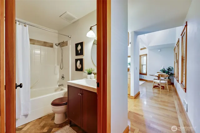a bathroom with a toilet a sink and shower