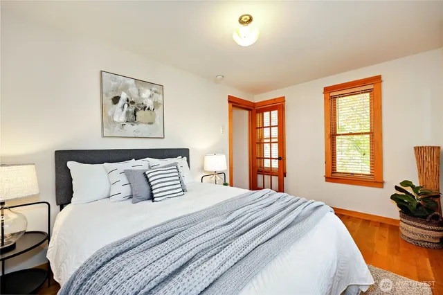 a bedroom with bed and a window