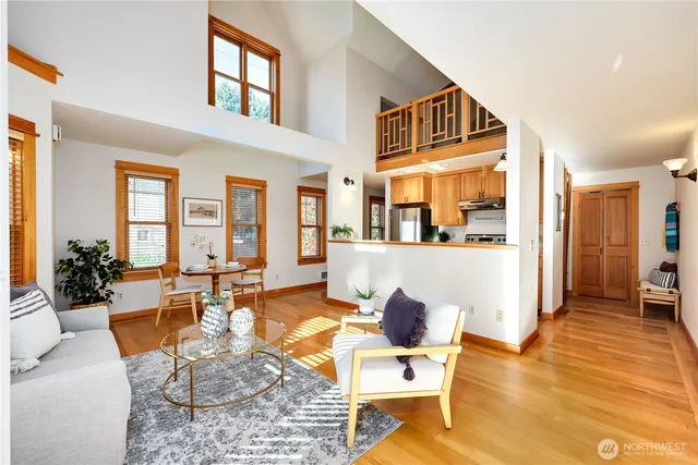a living room with fireplace furniture and a table