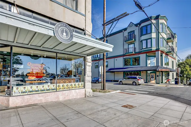 a front view of a house with outdoor seating