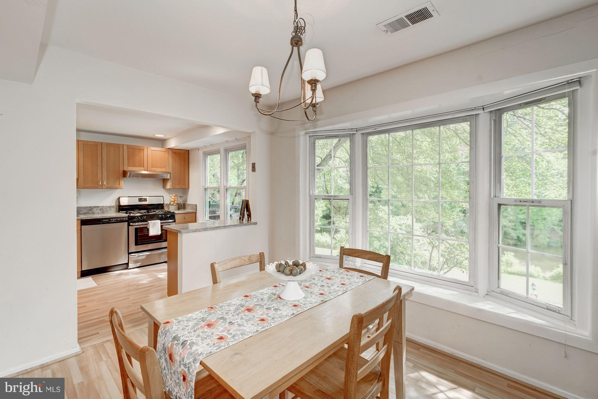9506 Burdett Road Burke, VA 22015 - Photo 10 of 30 Showcase windows in dining room, open to kitchen.
