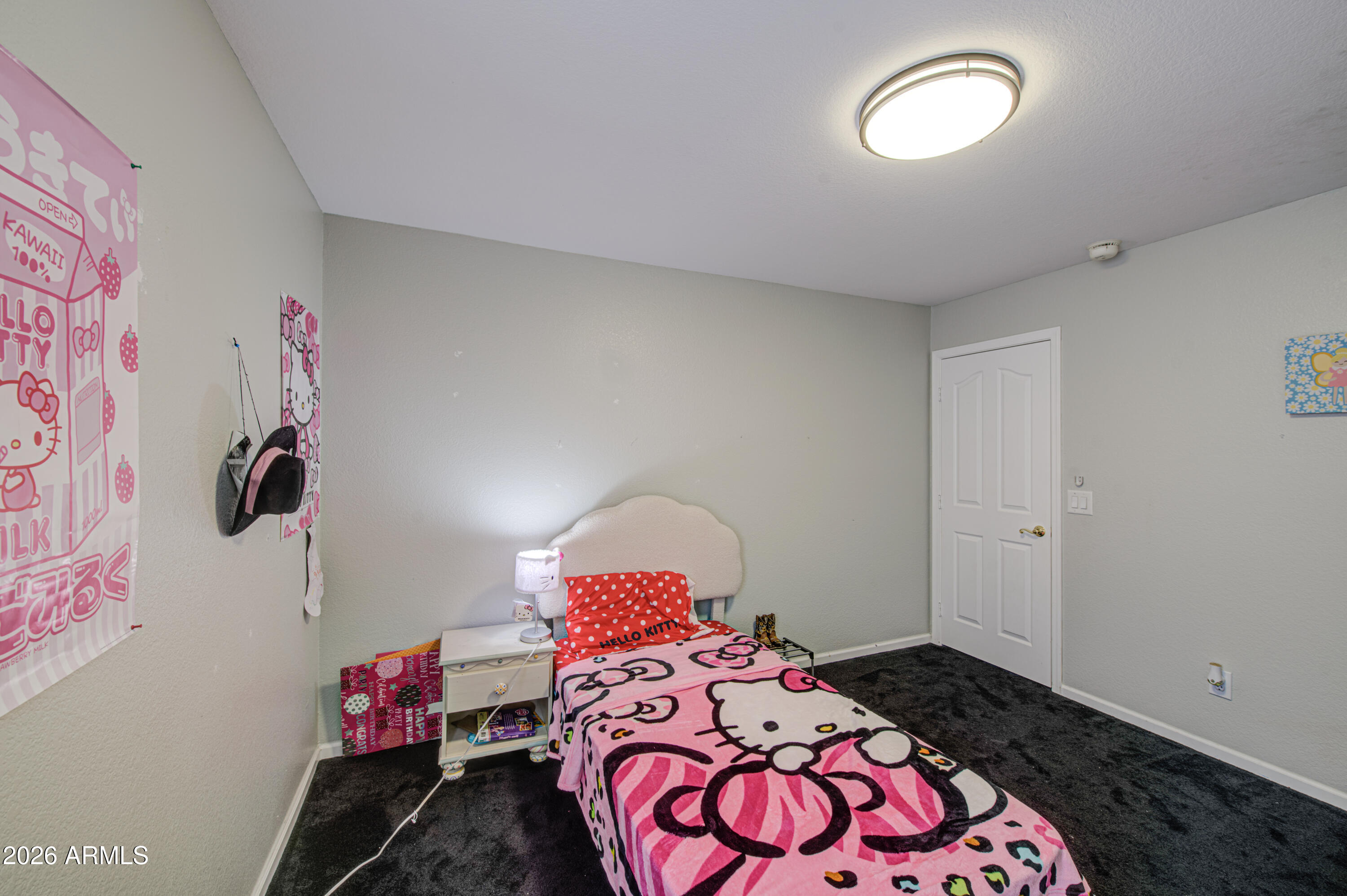 12403 West Monte Vista Road Avondale, AZ 85392 - Photo 37 of 63 a bedroom with a bed and a window