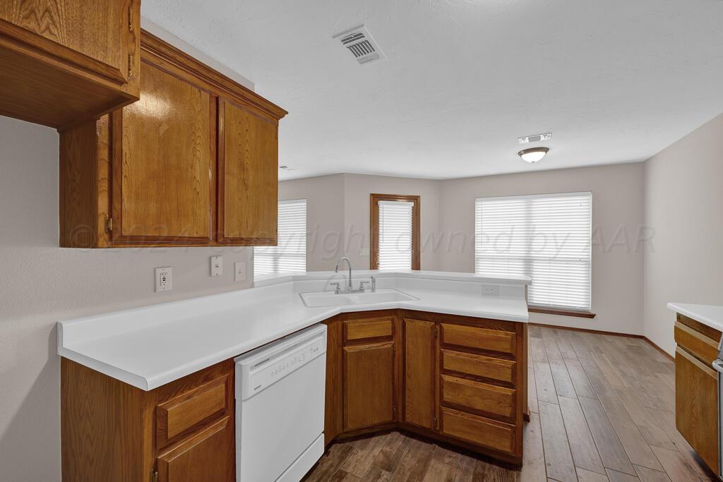 5236 Capulin Lane Amarillo, TX 79110 - Photo 8 of 24 a kitchen with a sink and cabinets