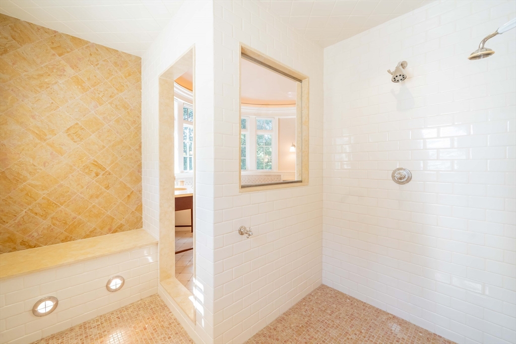 197 Grant Street Lexington, MA 02420 - Photo 23 of 42 a bathroom with a tub shower and a sink