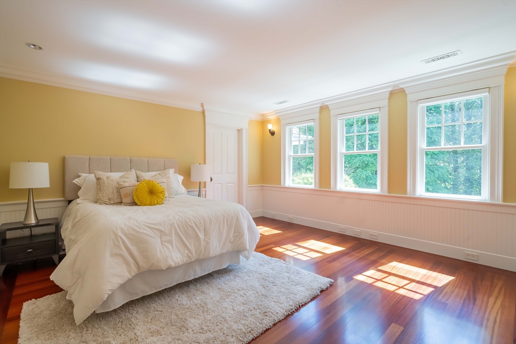 197 Grant Street Lexington, MA 02420 - Photo 24 of 42 a bedroom with a bed and a large window