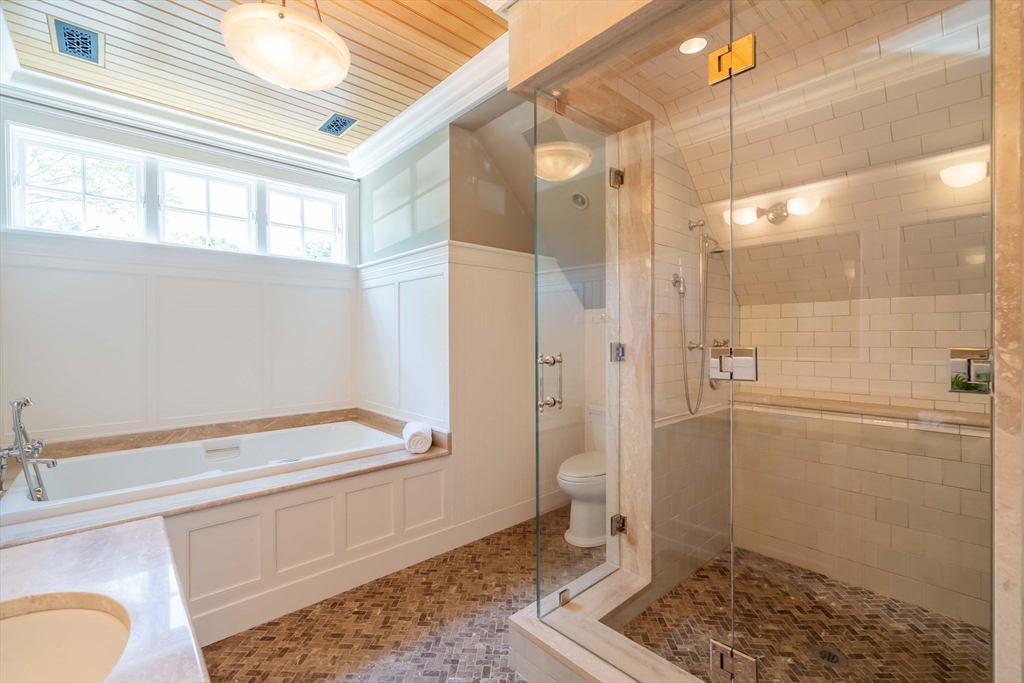 197 Grant Street Lexington, MA 02420 - Photo 31 of 42 a bathroom with a bathtub and shower