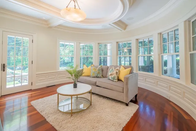 a kitchen with center island wooden floor and white appliances