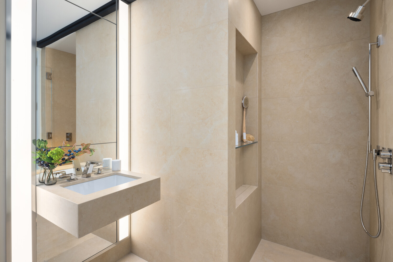 53 West 53rd Street, Unit 20D Manhattan, NY 10019 - Photo 10 of 12 a bathroom with a sink and a mirror