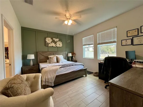 a spacious bathroom with a double vanity sink a mirror and shower