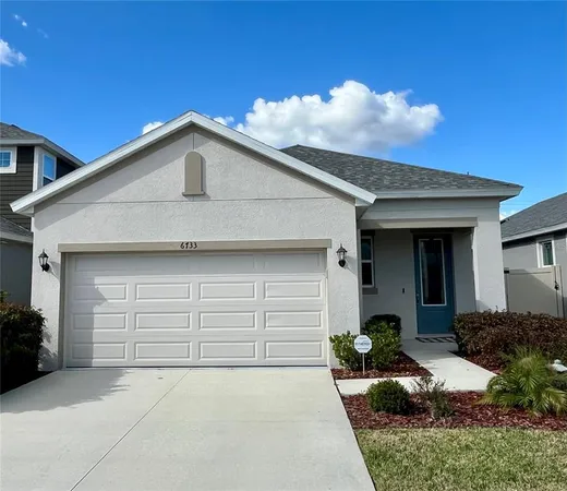 a front view of a house with garage