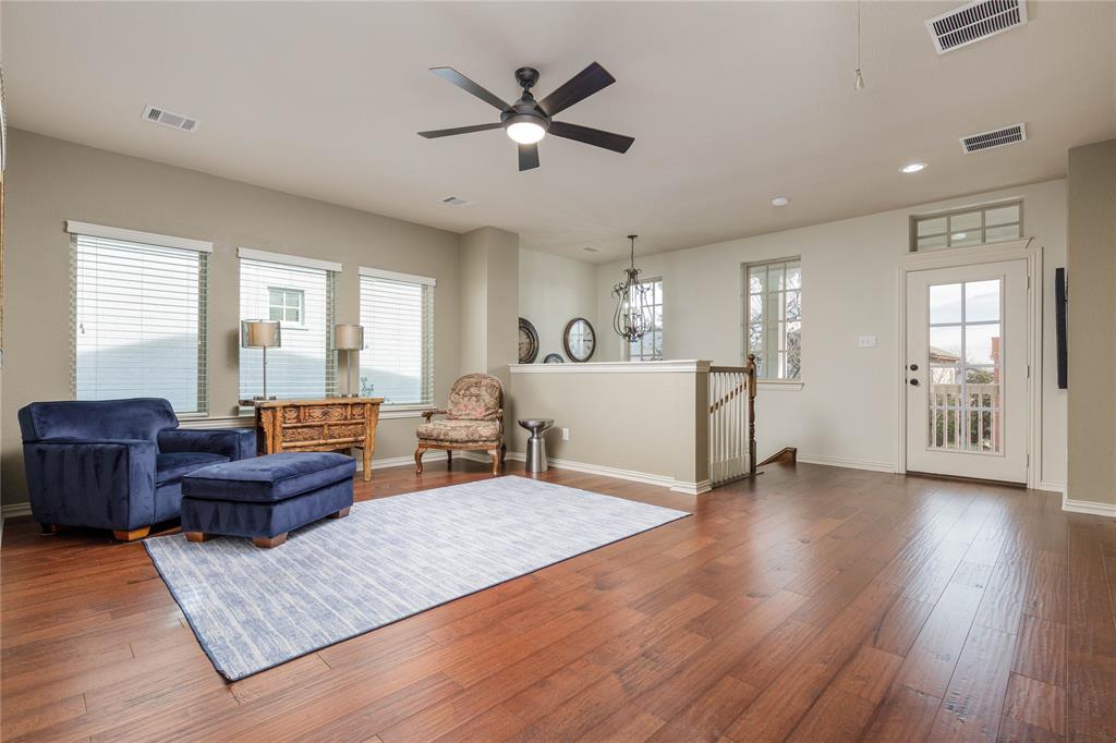 2205 State Boulevard McKinney, TX 75071 - Photo 17 of 40 a living room with furniture window and wooden floor