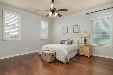 a bedroom with bed and window