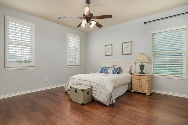 a bedroom with bed and window