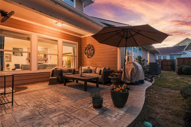 a living room with furniture and a umbrella