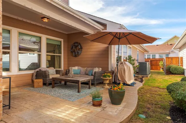 a view of a patio with couches and potted plants