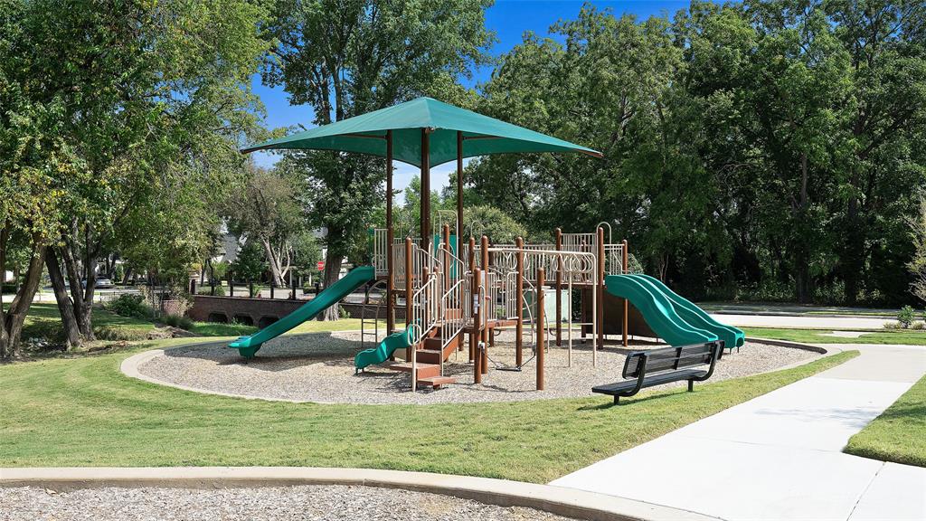 2205 State Boulevard McKinney, TX 75071 - Photo 34 of 40 a view of a park with a slide