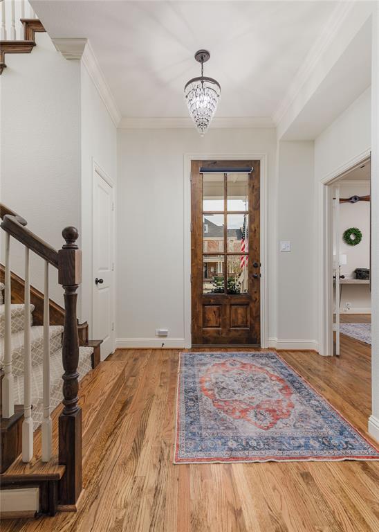 2205 State Boulevard McKinney, TX 75071 - Photo 5 of 40 a view of an empty room with wooden floor and a window