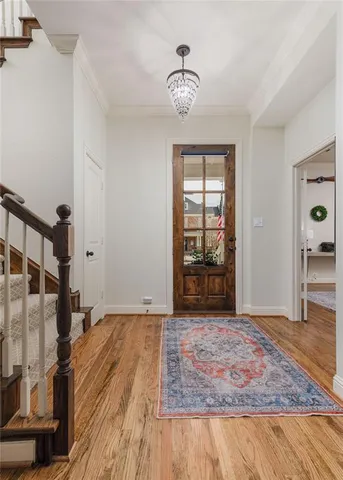 a view of a dining room kitchen with furniture and wooden floor
