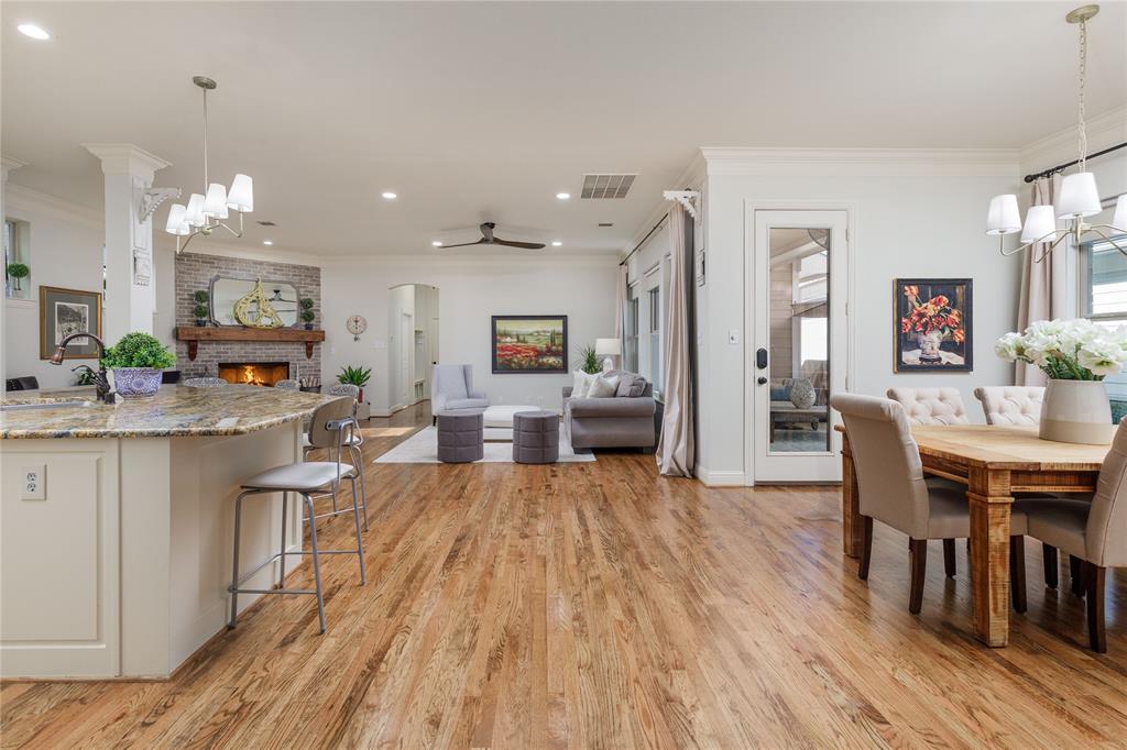 2205 State Boulevard McKinney, TX 75071 - Photo 39 of 40 a view of a dining room kitchen with furniture and wooden floor
