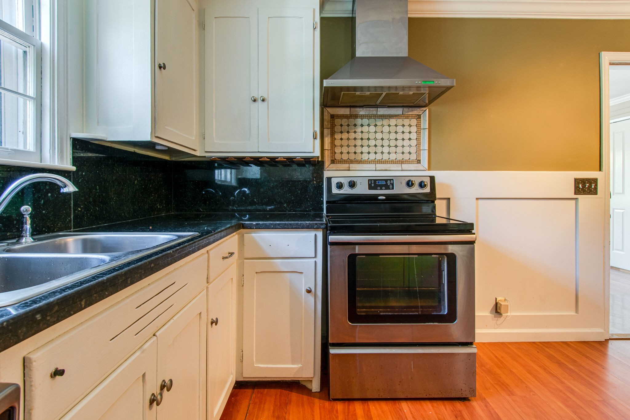 2302 Deerwood Road Nashville, TN 37214 - Photo 13 of 30 a kitchen with granite countertop a stove and a sink