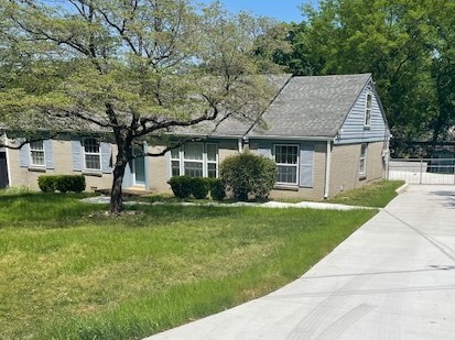 2302 Deerwood Road Nashville, TN 37214 - Photo 2 of 30 a house that is sitting in the grass
