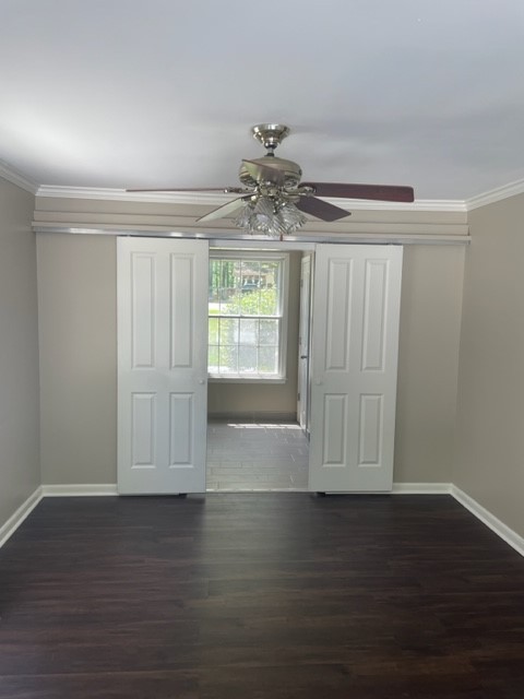 2302 Deerwood Road Nashville, TN 37214 - Photo 24 of 30 a view of an empty room with wooden floor and a window
