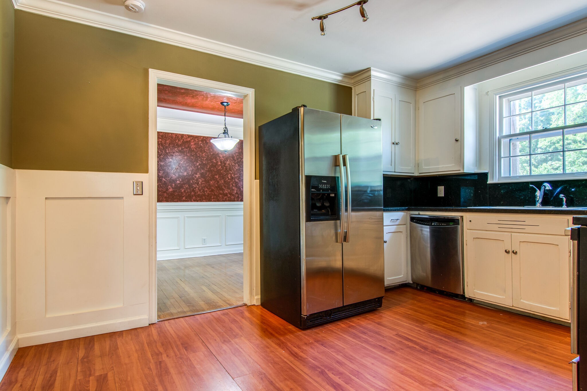 2302 Deerwood Road Nashville, TN 37214 - Photo 10 of 30 a view of a refrigerator in kitchen and wooden floor