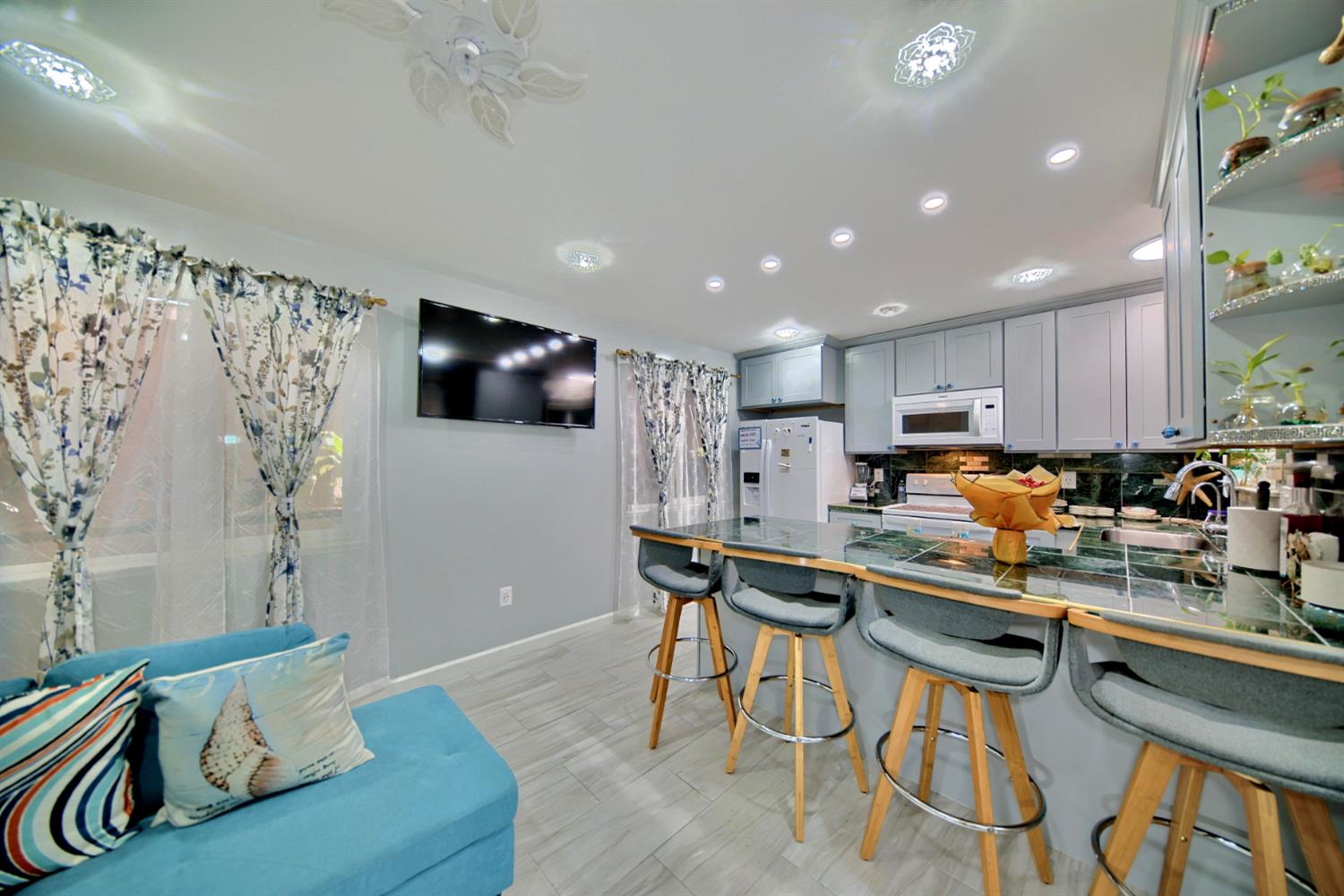 2013 Robertson Road Modesto, CA 95351 - Photo 17 of 24 a kitchen with stainless steel appliances granite countertop a table chairs sink and cabinets
