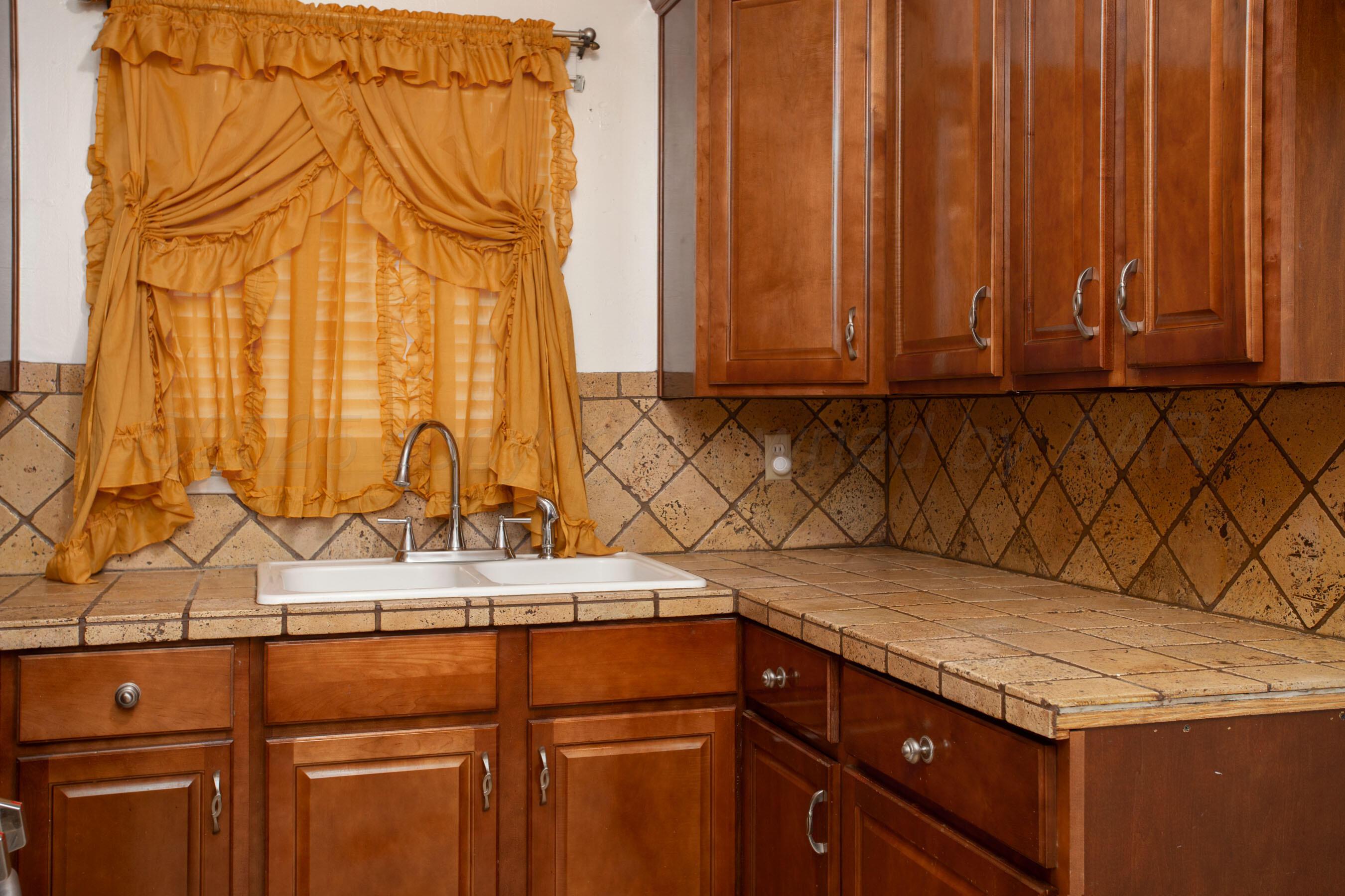 3115 Palm Street Amarillo, TX 79107 - Photo 12 of 31 a kitchen with a sink and cabinets