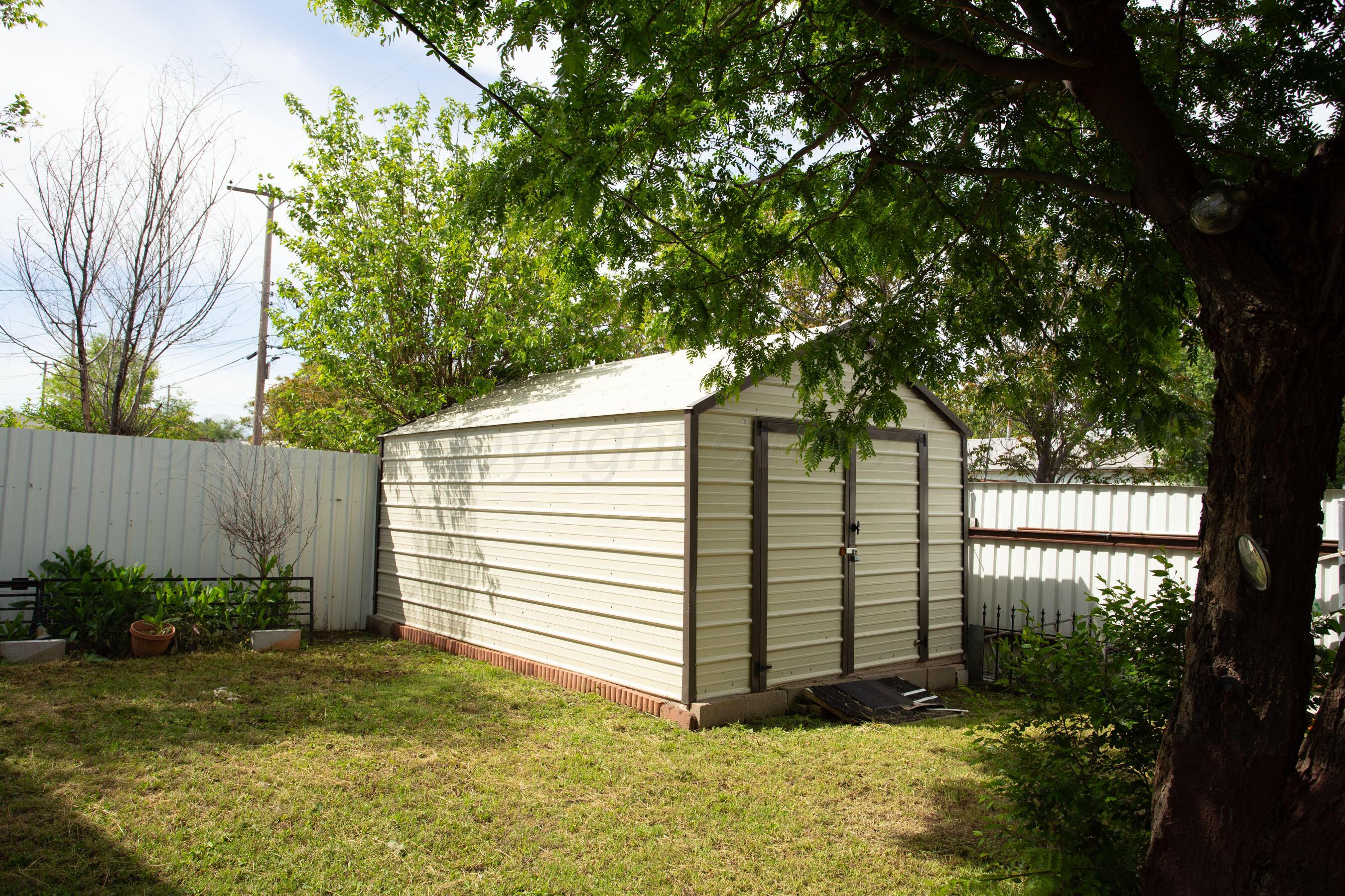 3115 Palm Street Amarillo, TX 79107 - Photo 30 of 31 a view of a house with a yard and plants