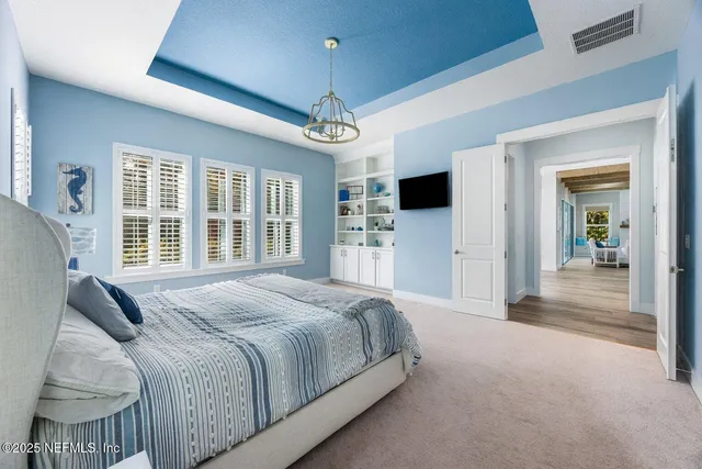 a spacious bathroom with a granite countertop sink a toilet a mirror and shower