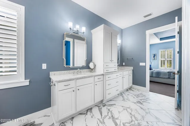 a bathroom with a bathtub and a window