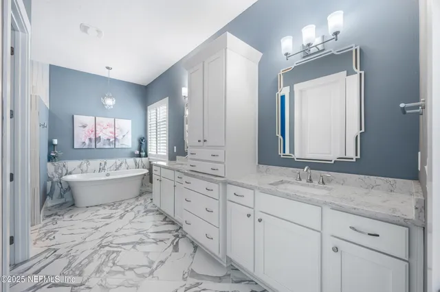 a view of walk in closet with clothes