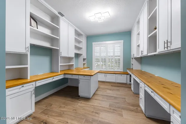 a spacious bedroom with a bed and a couch