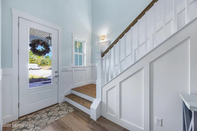 a view of a hallway view with wooden floor and bedroom view