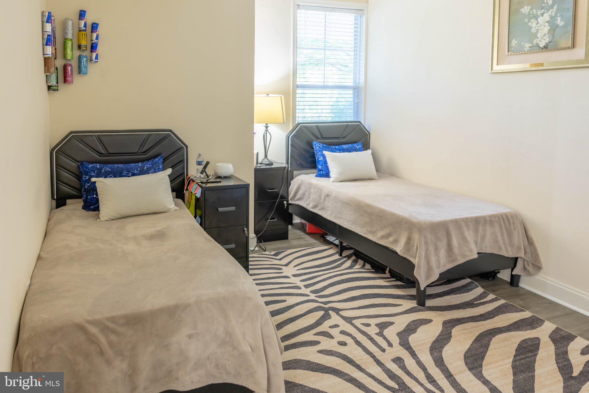 12824 Clarksburg Square Road, Unit 105 Clarksburg, MD 20871 - Photo 64 of 96 Cozy twin bedroom with modern flair.