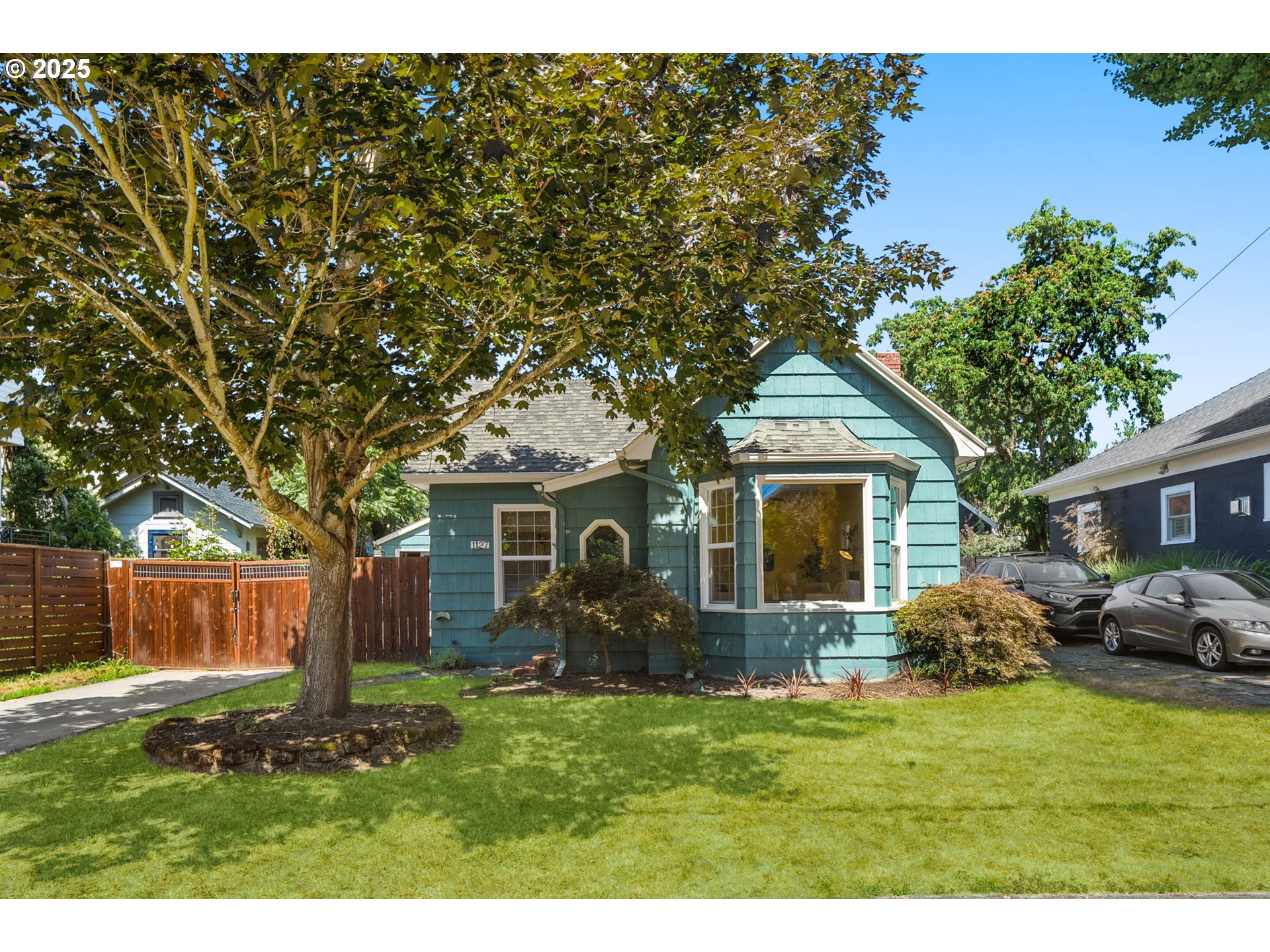 a front view of house with yard and green space