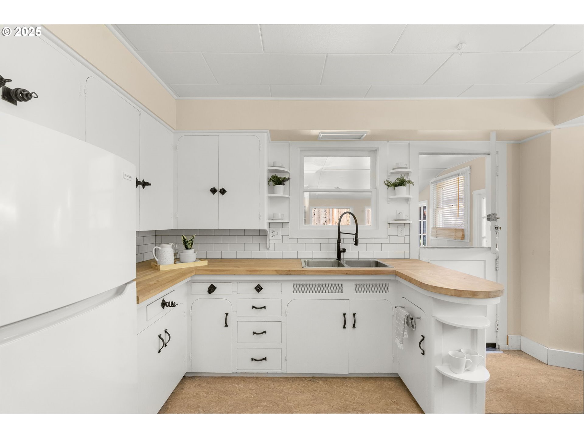 1127 Southeast Sherrett Street Portland, OR 97202 - Photo 12 of 37 a kitchen with a sink and cabinets