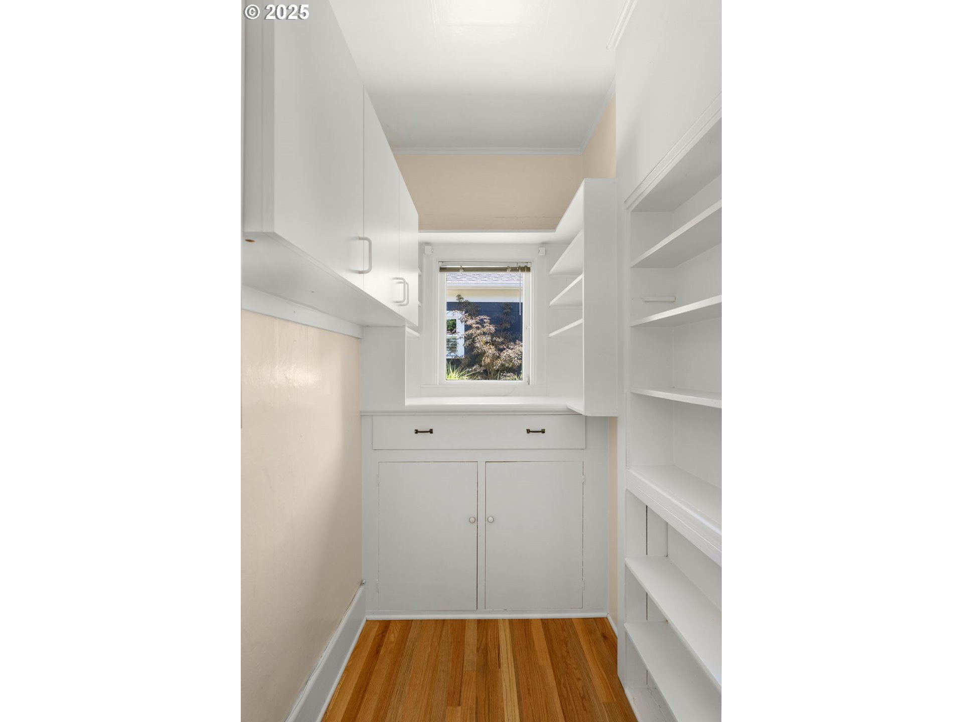 1127 Southeast Sherrett Street Portland, OR 97202 - Photo 22 of 37 a view of a room with cabinet and windows