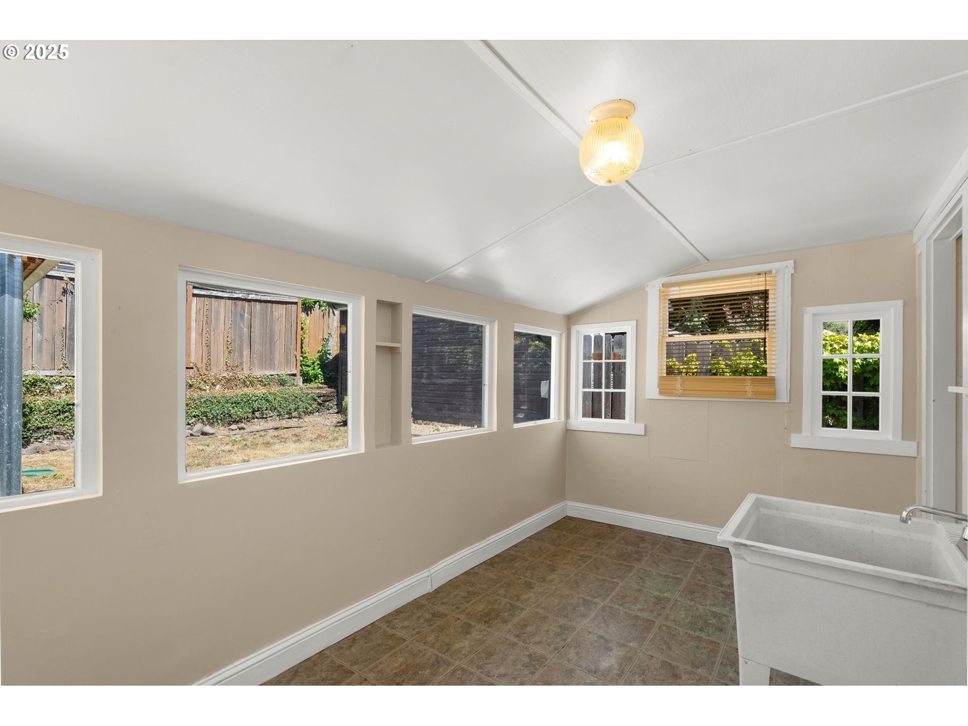 1127 Southeast Sherrett Street Portland, OR 97202 - Photo 23 of 37 a view of an empty room with a window