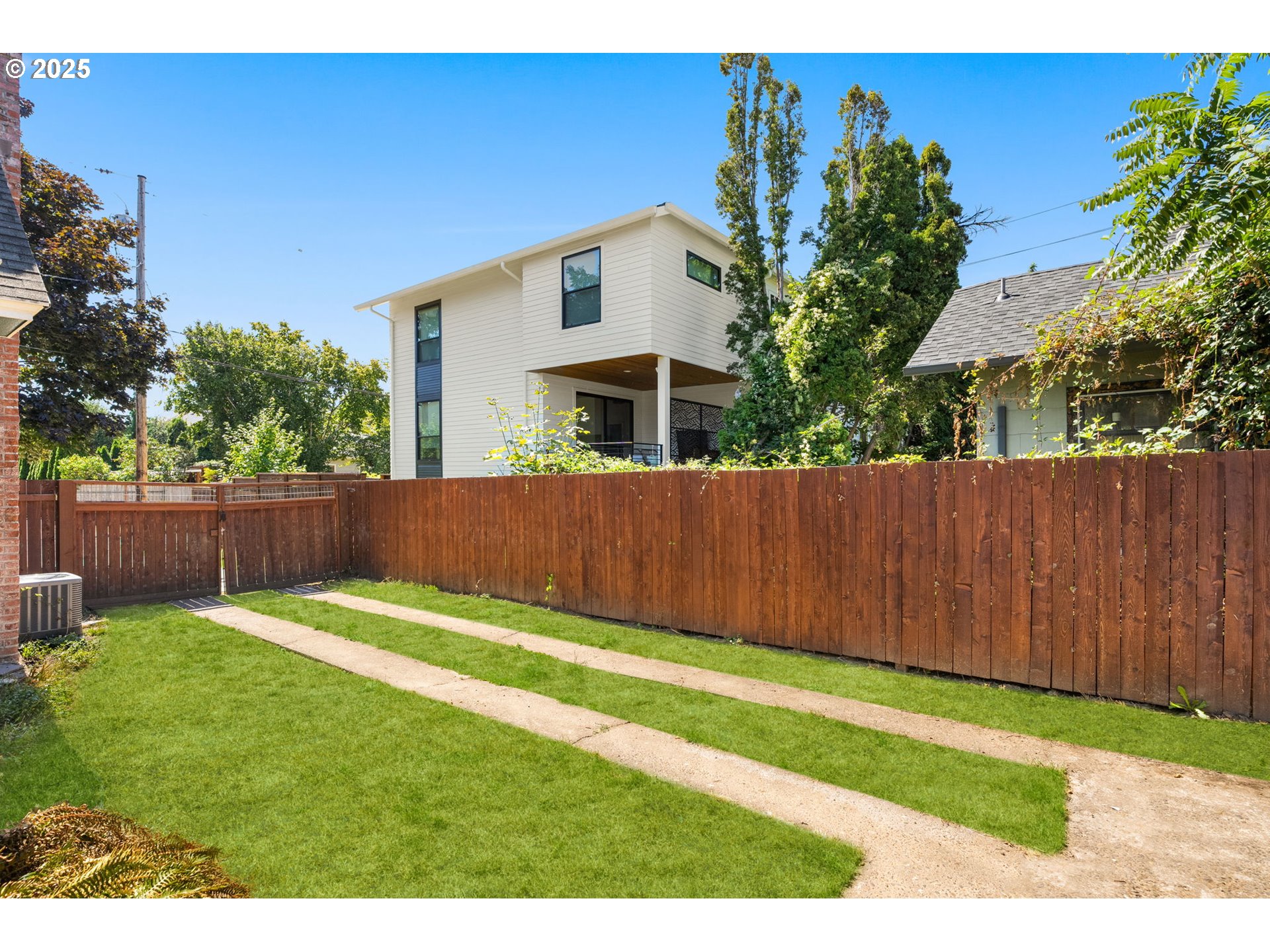 1127 Southeast Sherrett Street Portland, OR 97202 - Photo 24 of 37 a front view of a house with a yard