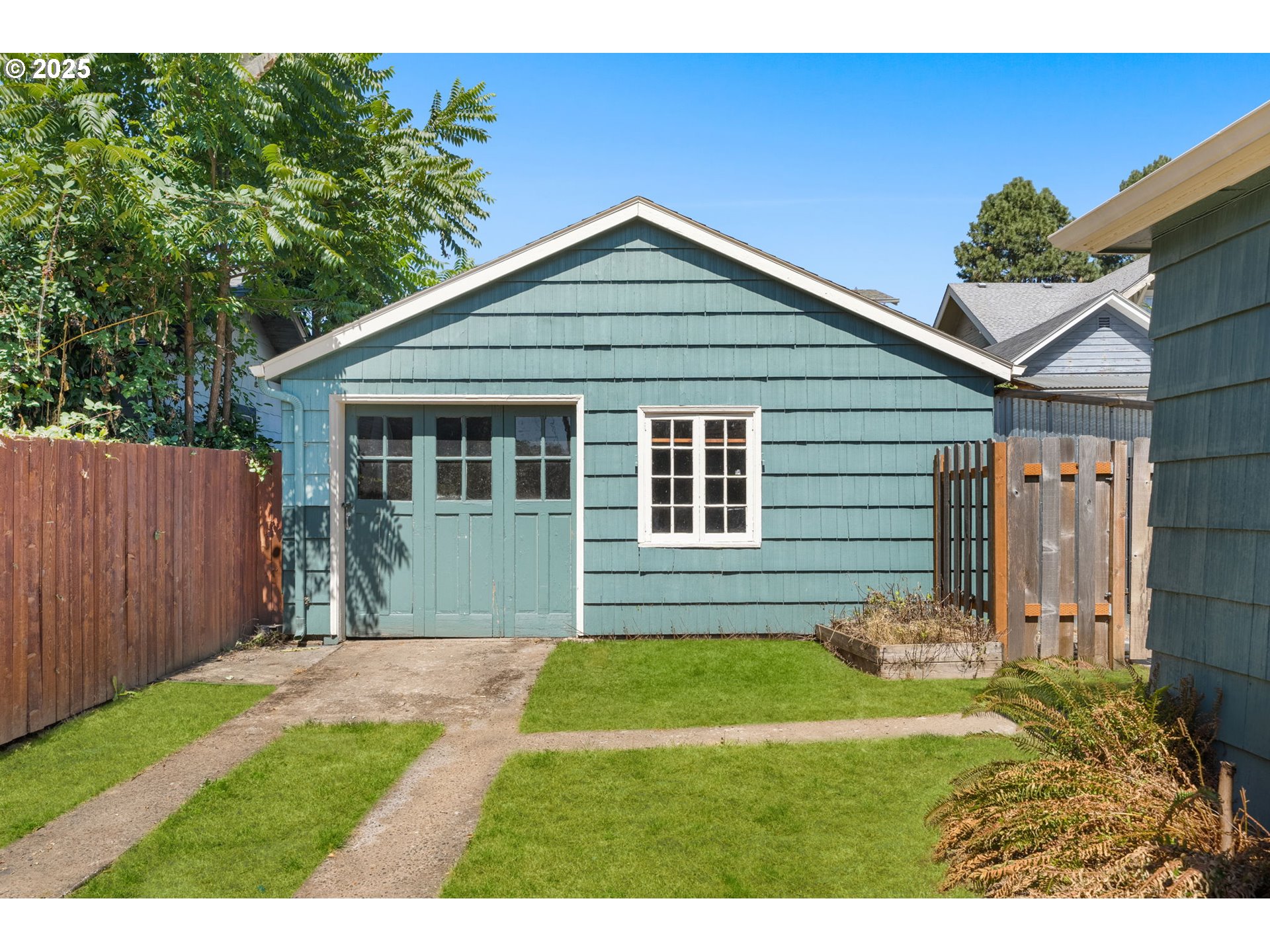 1127 Southeast Sherrett Street Portland, OR 97202 - Photo 25 of 37 a front view of a house with a yard