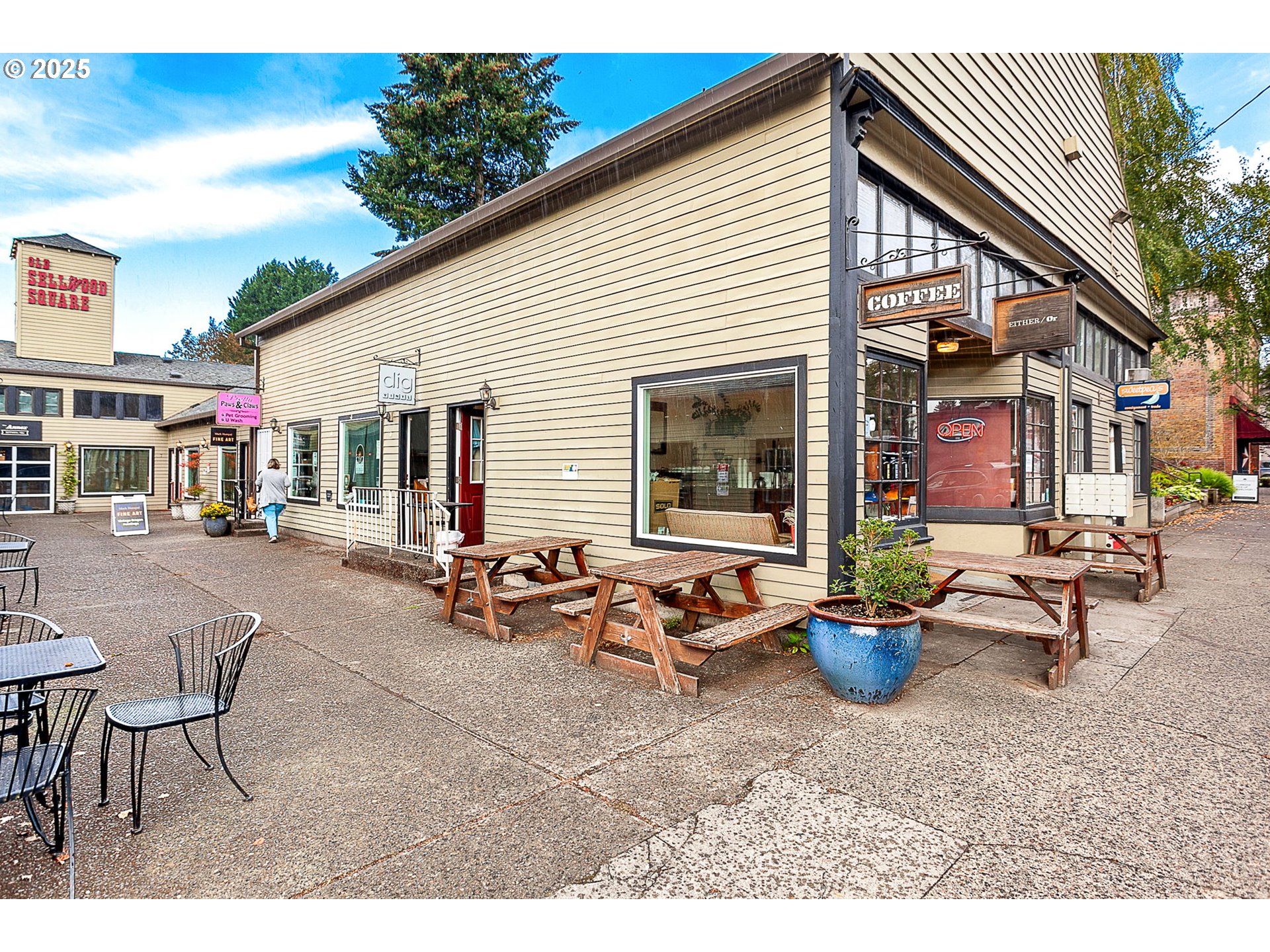 1127 Southeast Sherrett Street Portland, OR 97202 - Photo 31 of 37 a view of a patio with table and chairs potted plants and wooden fence