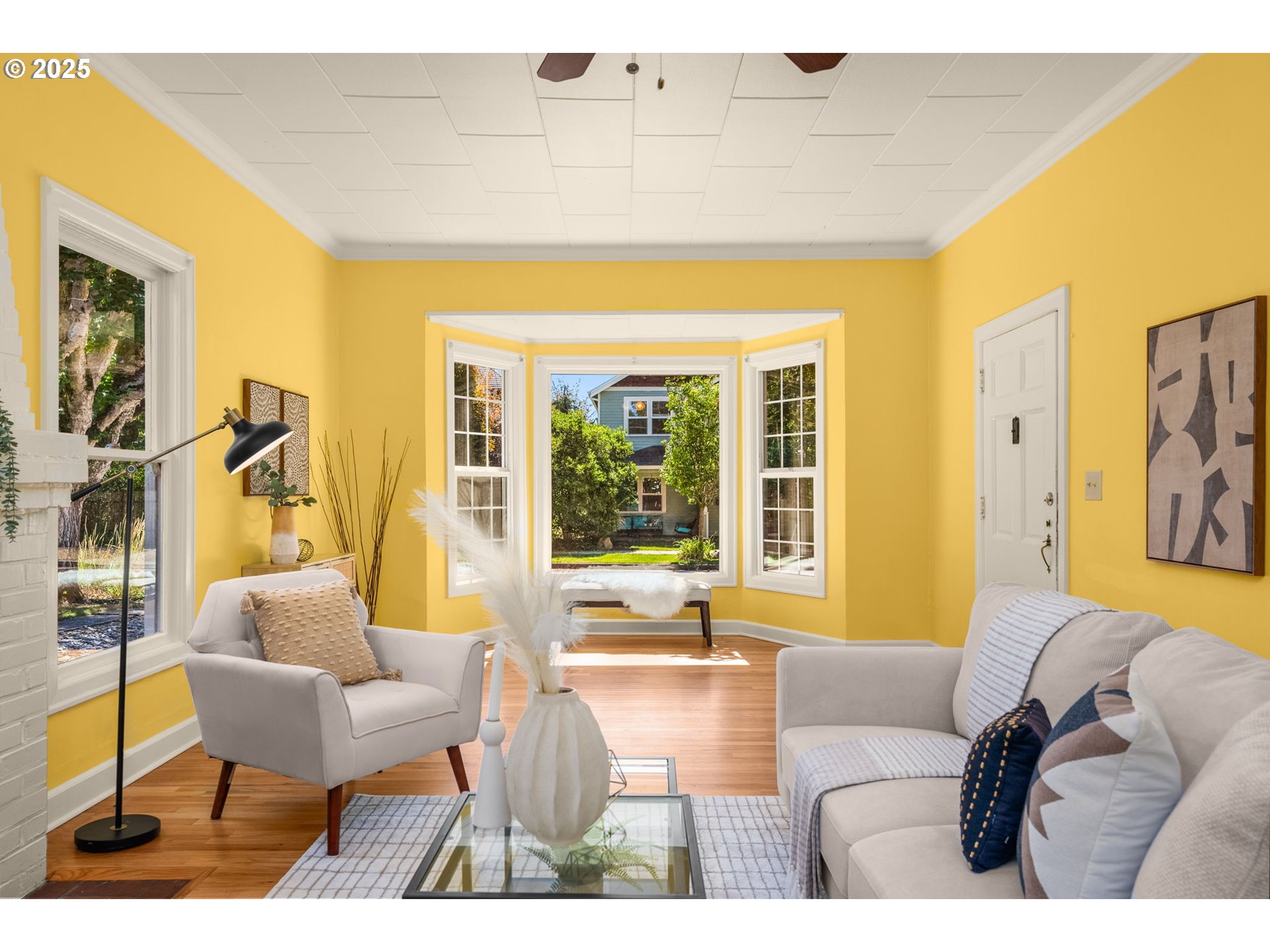 1127 Southeast Sherrett Street Portland, OR 97202 - Photo 10 of 37 a living room with furniture and a large window