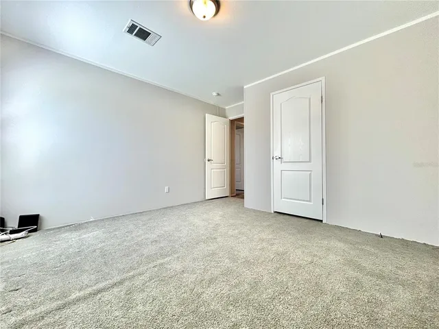 an empty room with closet area