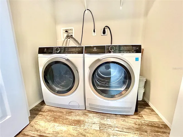 a utility room with dryer and washer