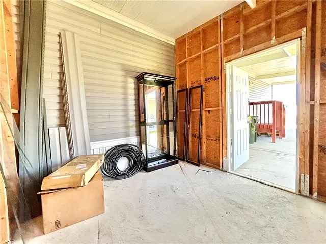 a view of a livingroom with entryway and bedroom